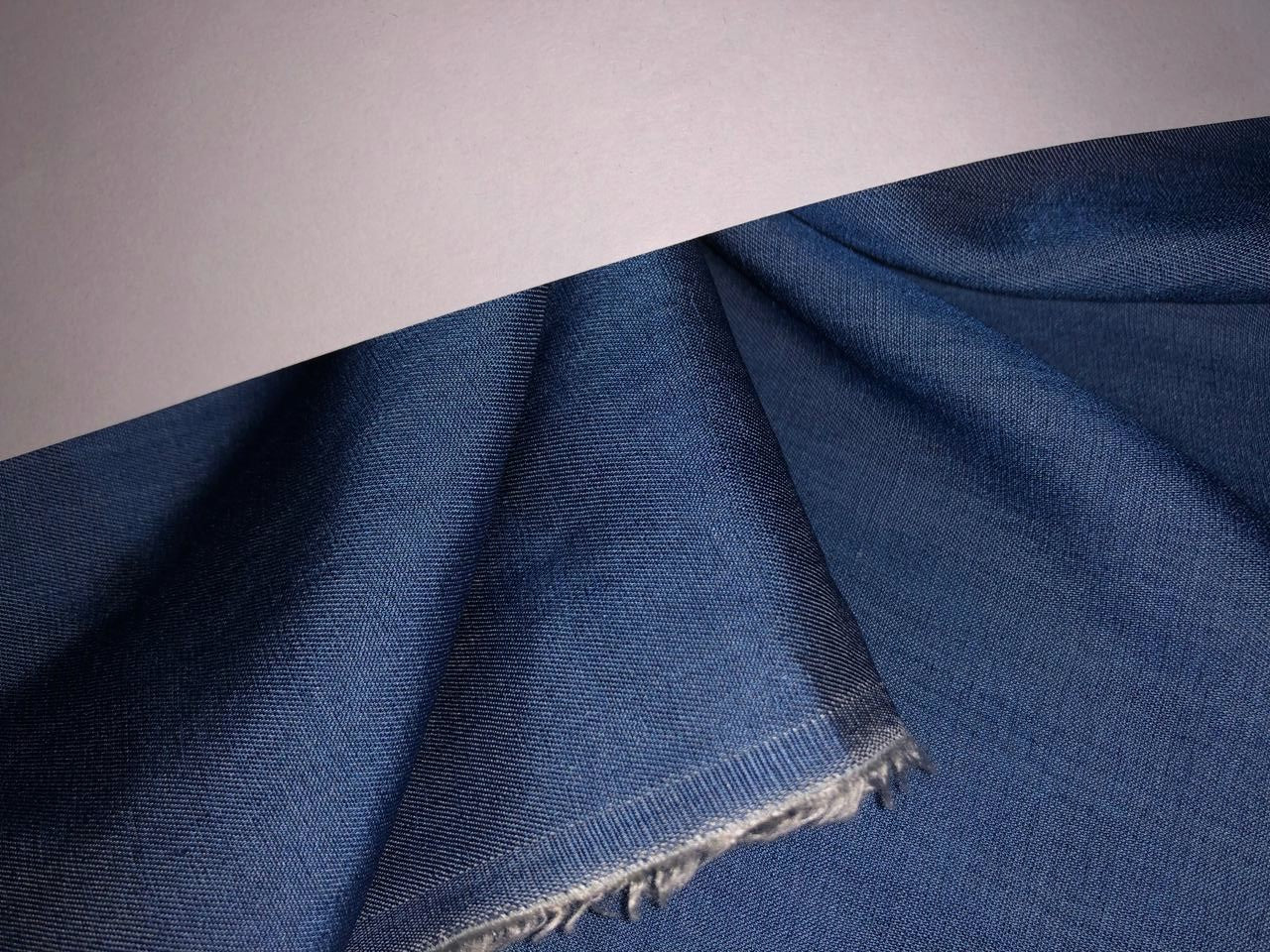 100% Tencel  Denim 5 ounce  Fabric  58" wide available in 7 colors blue/ dark denim blue/ charcoal grey / charcoal black/parrot green/bright yellow and sage