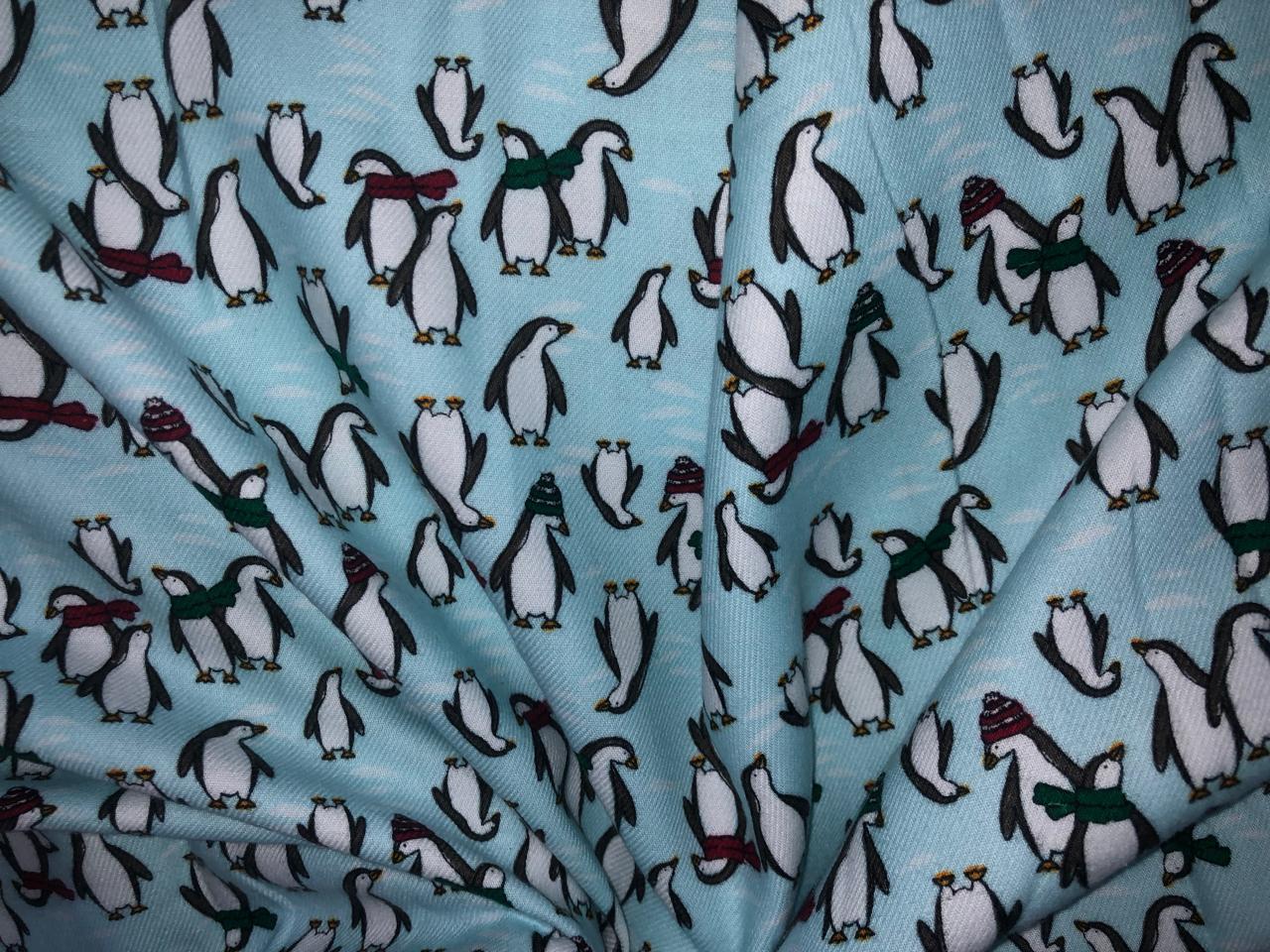 100% Cotton flannel Print 58"wide available in 3 prints penguin, snowmen and skiing on ice