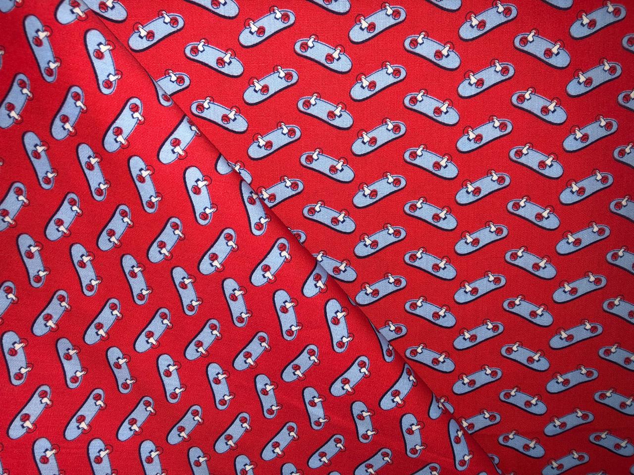 100% Cotton Poplin  Beach Prints 58" wide available in 4 prints bright orange flowers, / bird ,red with blue skates and the beach scene