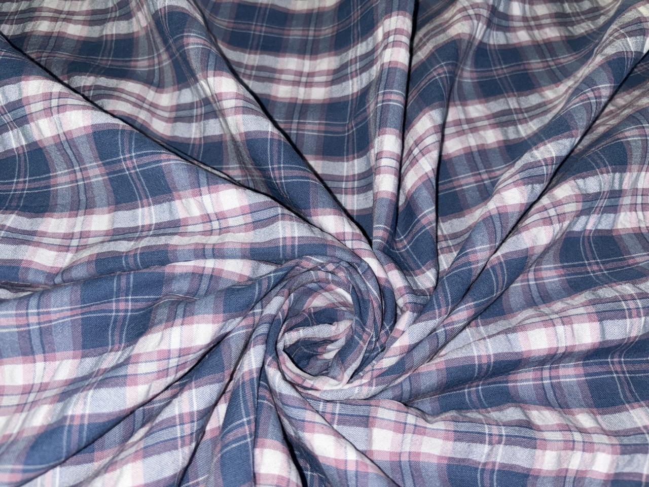 100 % cotton seersucker yarn dyed American plaids  manufactured  by Arvind mills, 58 inches wide /147 cms,available in 2 colors BLUES /PURPLES AND WHITE and  BLUEISH GREY/GREY/PINKS AND WHITE IVORY